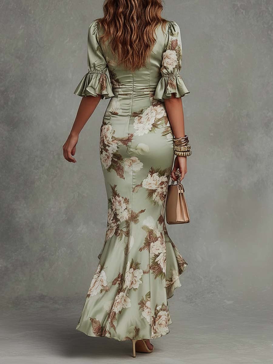 Anna - Abito lungo asimmetrico in satin verde con scollatura a V, maniche a sbuffo e motivo floreale