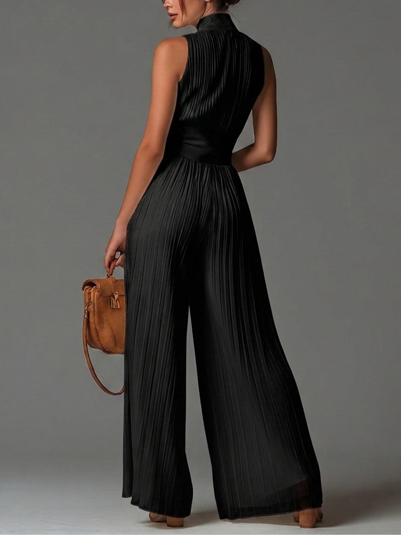 Tuta in chiffon nera senza maniche con scollo a V e zip, pantaloni ampi plissettati