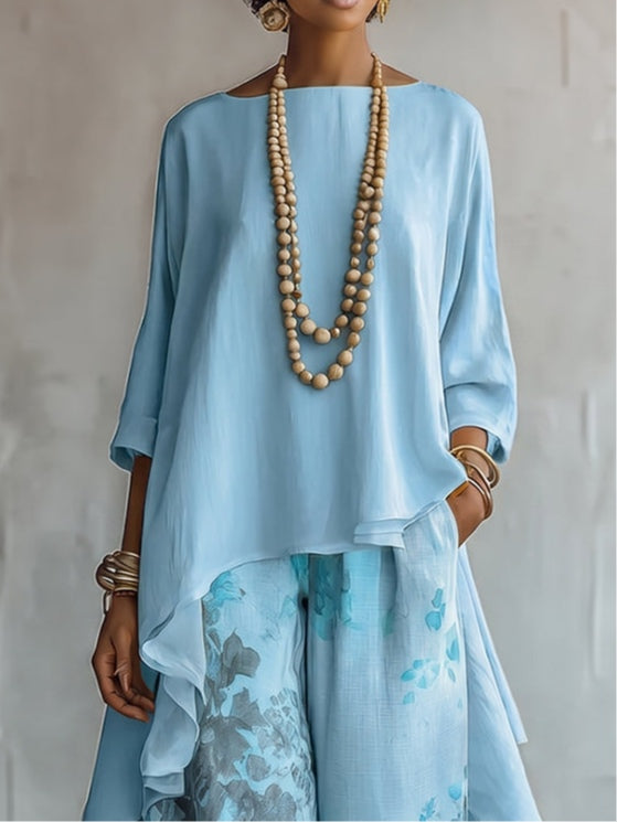 Set Top Asimmetrico Blu e Pantaloni Largo a Fiori