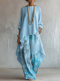 Set Top Asimmetrico Blu e Pantaloni Largo a Fiori