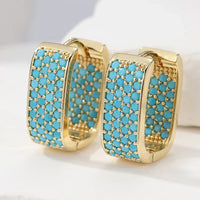 Orecchini Huggie in Oro con Pavé Turchese